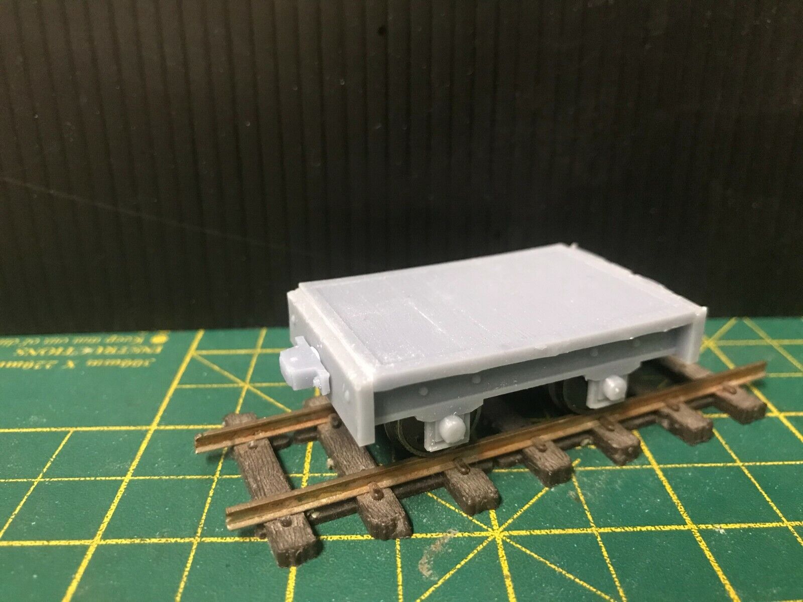 Gn15 narrow gauge flat wagon kit shown assembled on 16.5mm track with optional 12.5mm wheelset displayed alongside