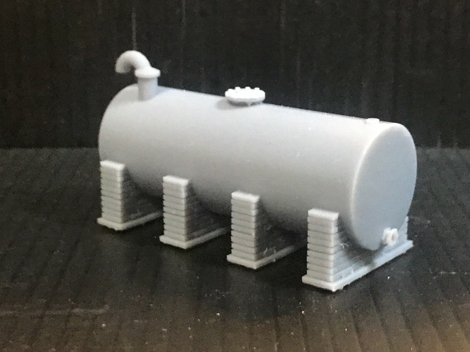Unpainted OO/HO/OO9 gauge single diesel depot tank on brick supports model kit, ready for priming and painting