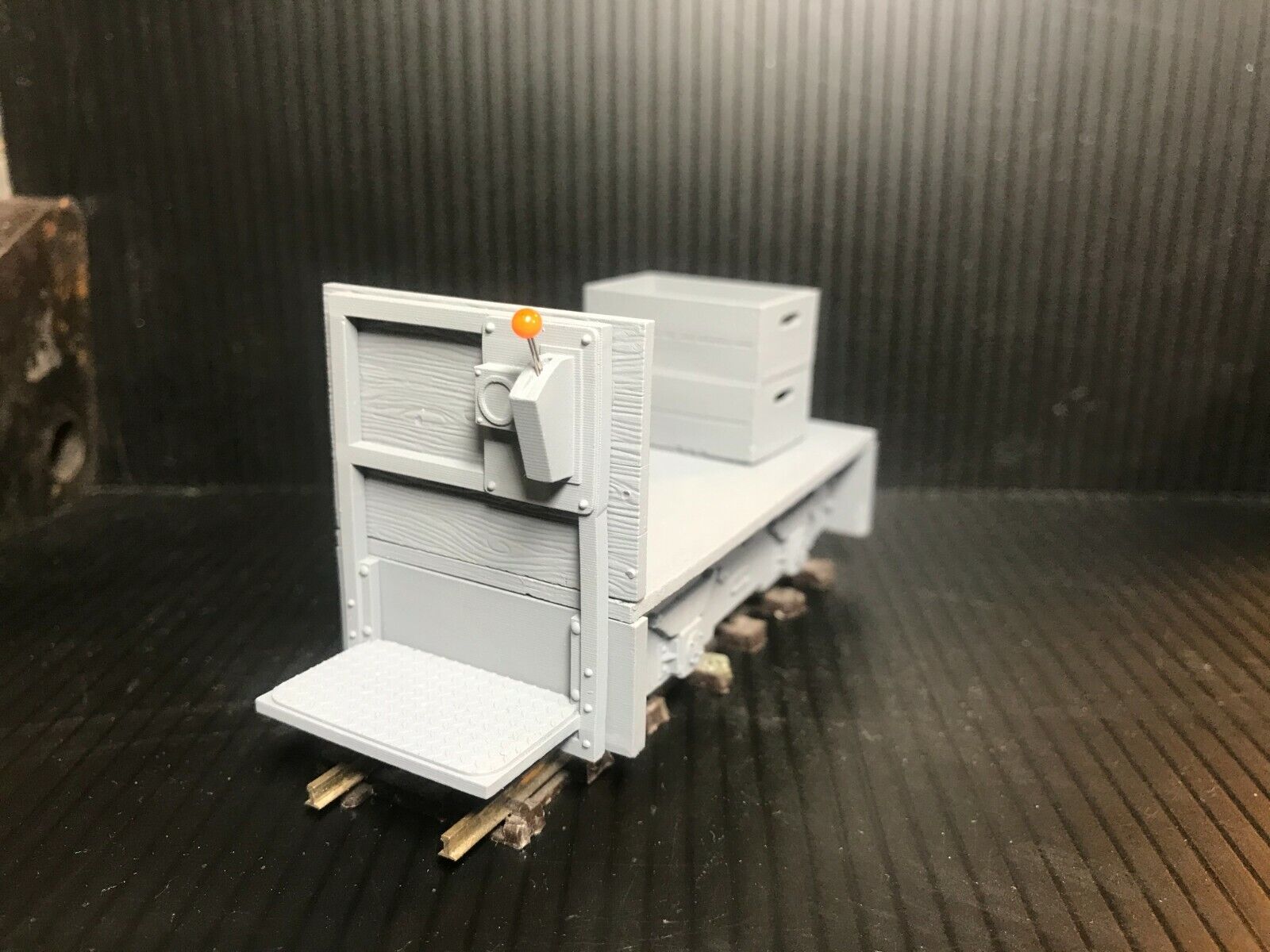Unpainted GN15 electric trolley resin kit on 00 gauge track, shown with Tenshodo motor bogie chassis and separate crate parts