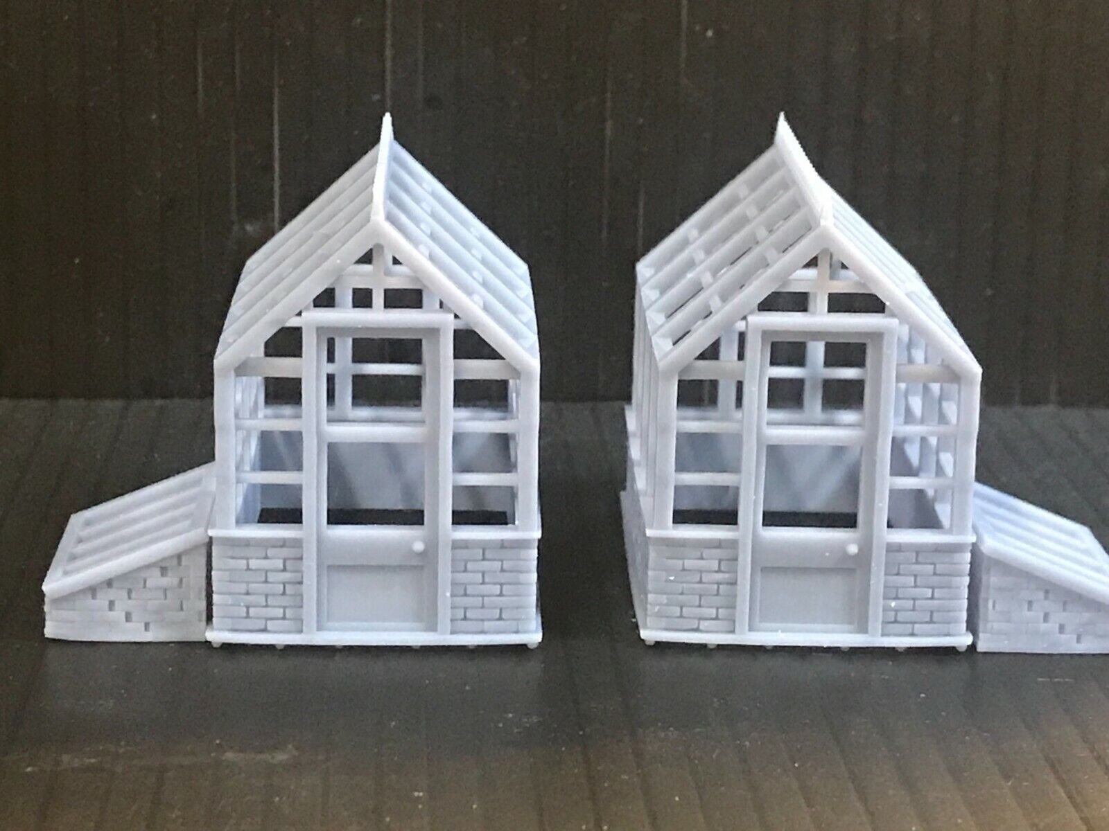Unpainted 00 gauge Victorian-style model railway kit with two resin greenhouses and two cold frames, ready to assemble and paint