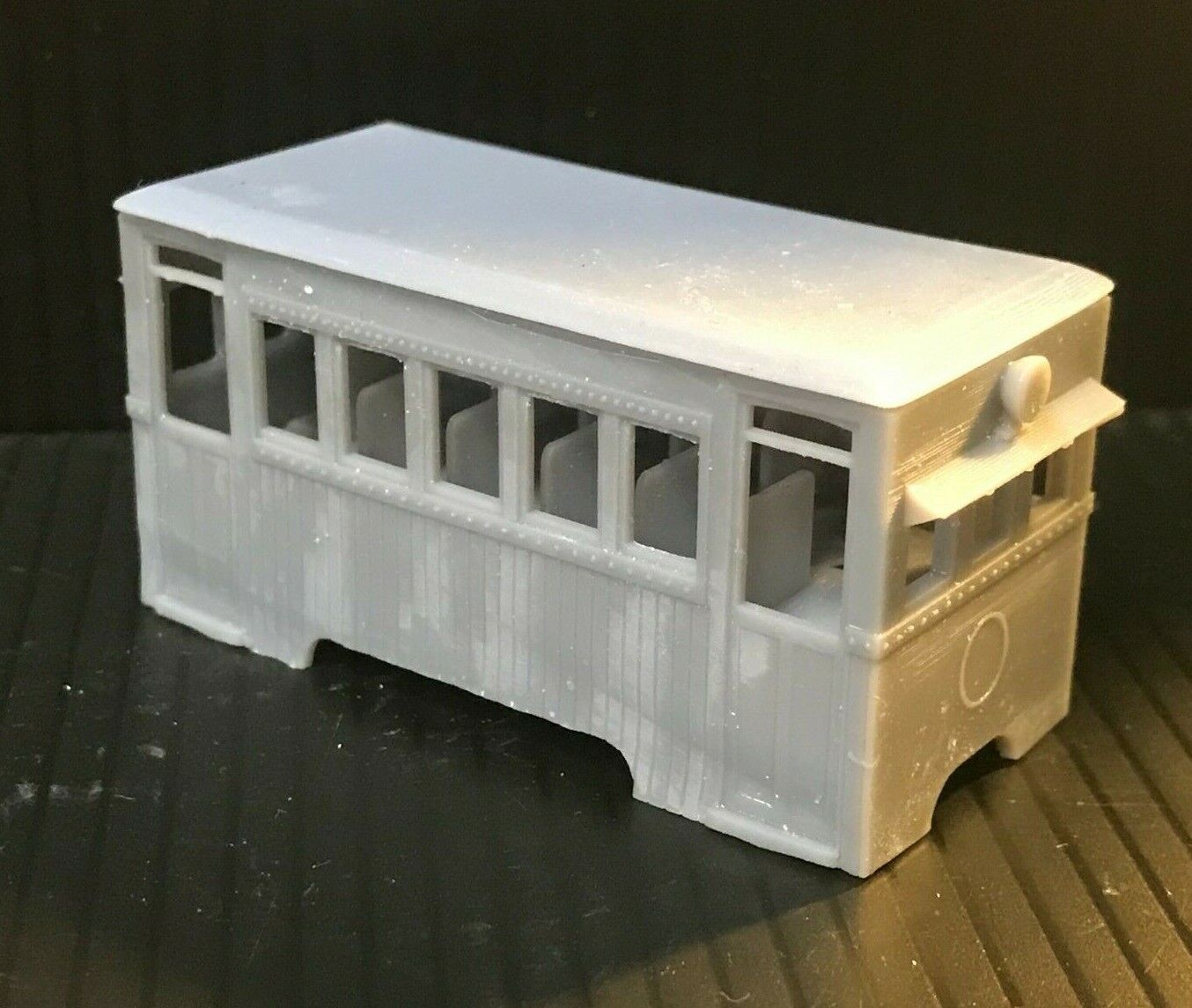 Unpainted OO9 narrow gauge prototype railbus body, roof and interior kit shown fitted to a compatible Kato 103/109/105 chassis