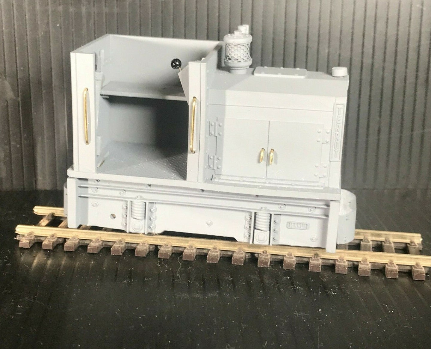 Unpainted GN15 diesel critter kit for G scale on 00 gauge track, shown with Tenshodo spud motor bogie chassis components