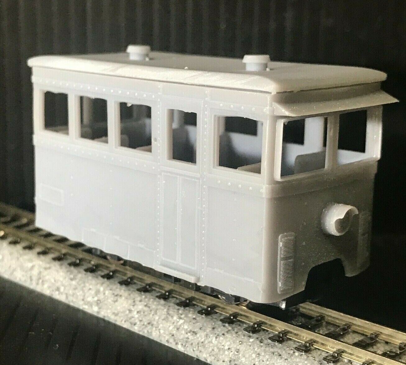 OO9 narrow gauge prototype tram railcar body kit shown on a Kato 103/109/105 chassis for model railway layouts