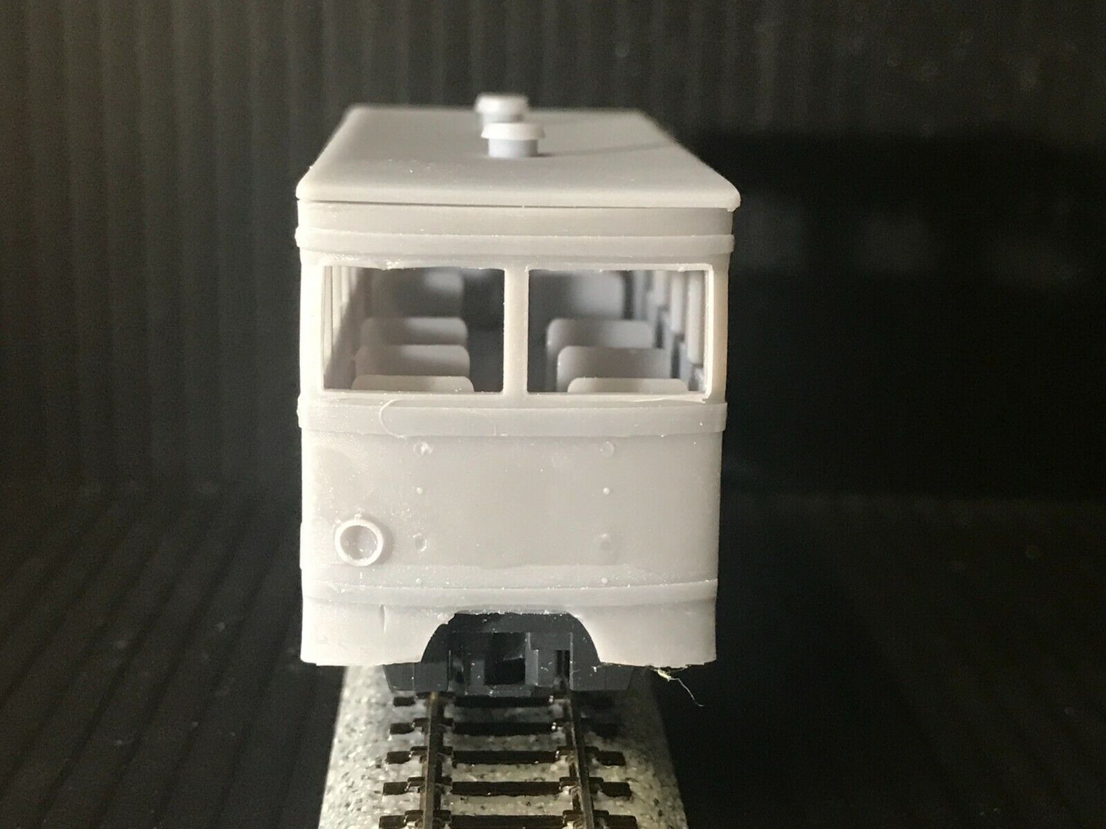 OO9 narrow gauge prototype tram railcar body kit shown on a Kato 103/109/105 chassis, with removable roof and interior seating.