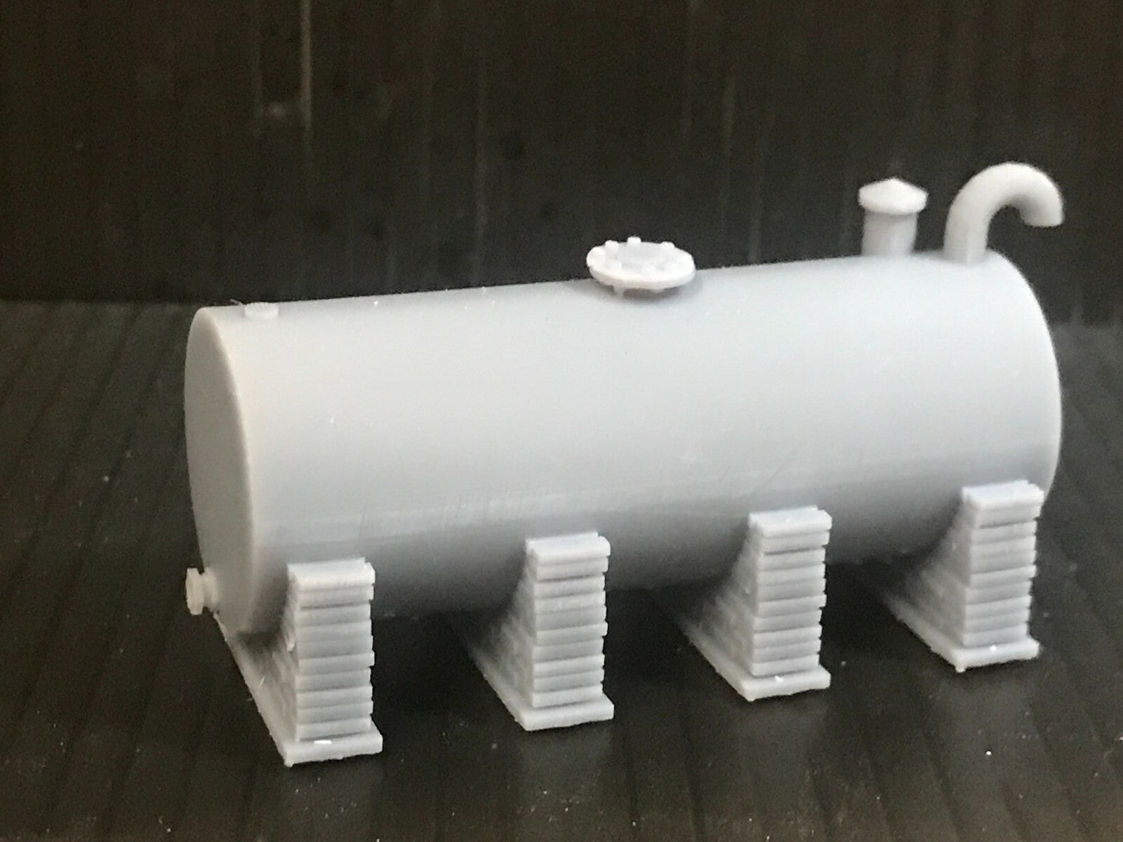 Unpainted OO/HO/OO9 gauge single diesel depot tank on brick supports model kit, ready for priming and painting