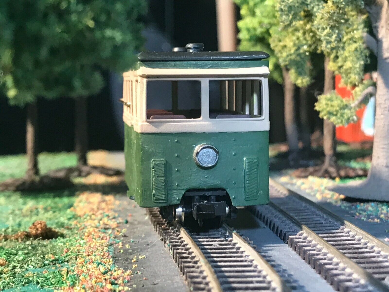 OO9 narrow gauge prototype tram railcar body kit shown on a Kato 103/109/105 chassis with removable roof and interior seating.