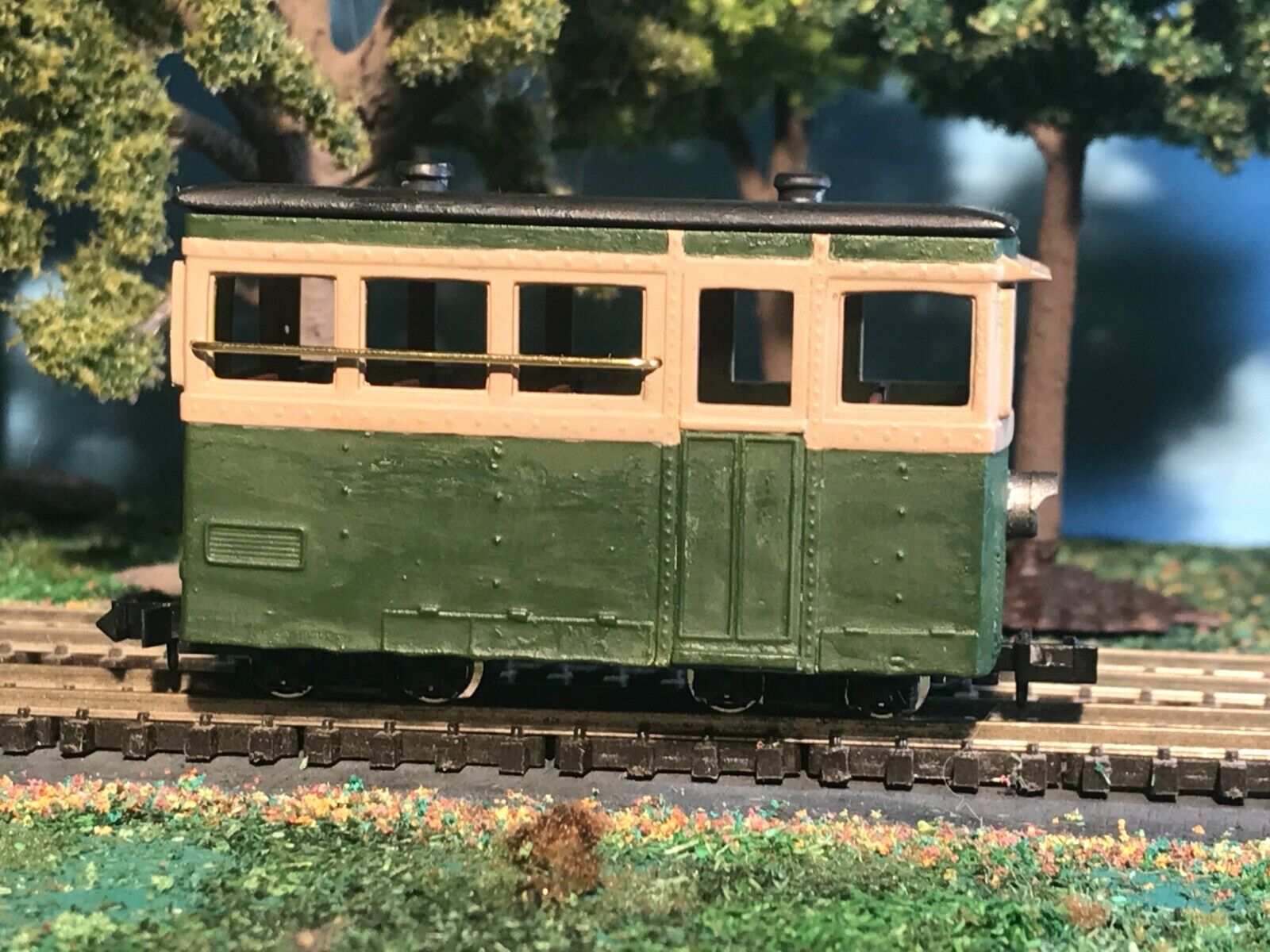 OO9 narrow gauge prototype tram railcar body kit shown on a Kato 103/109/105 chassis with removable roof and interior seating.