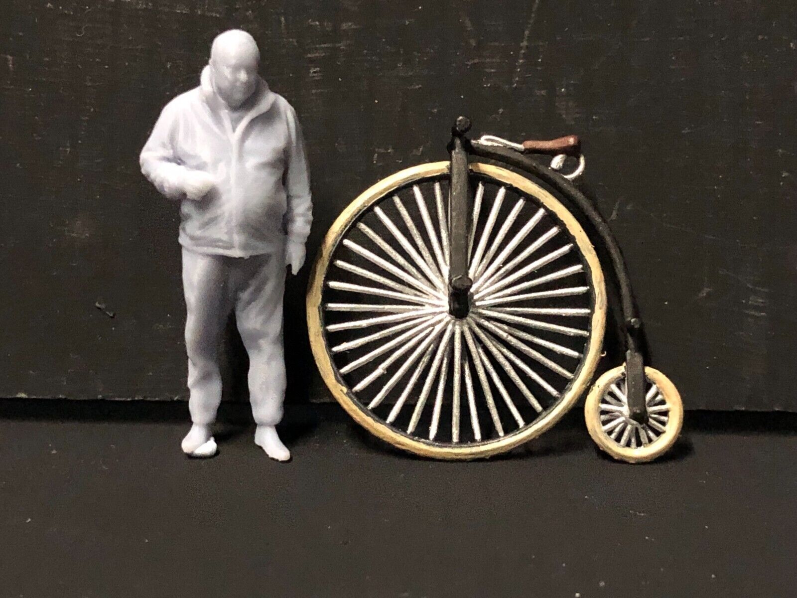 O gauge 1:43 scale model railway kit with two 7mm Victorian penny farthing bicycles for layout detailing