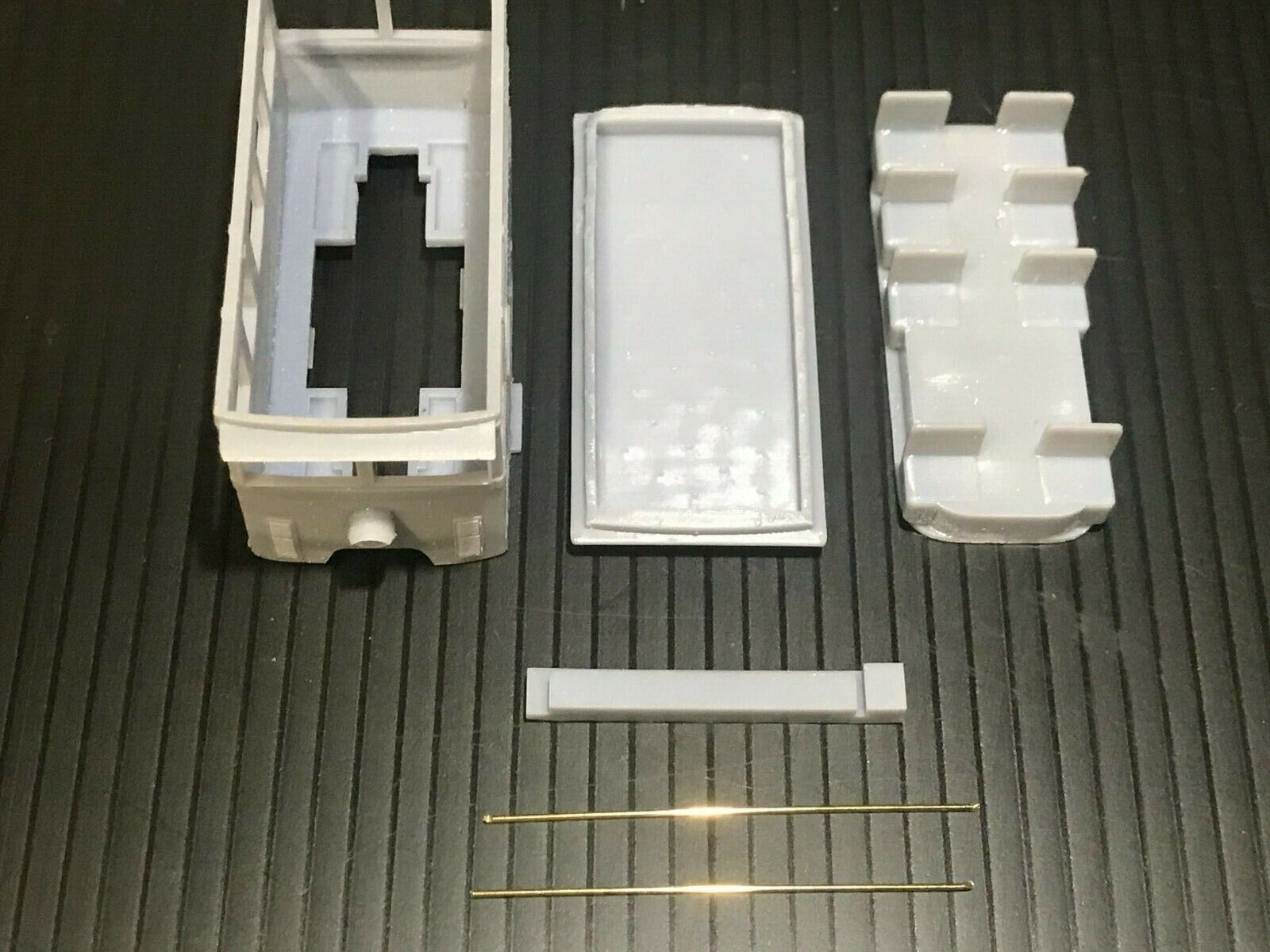 OO9 narrow gauge prototype tram railcar body kit shown on a Kato 103/109/105 chassis, unpainted and ready for assembly