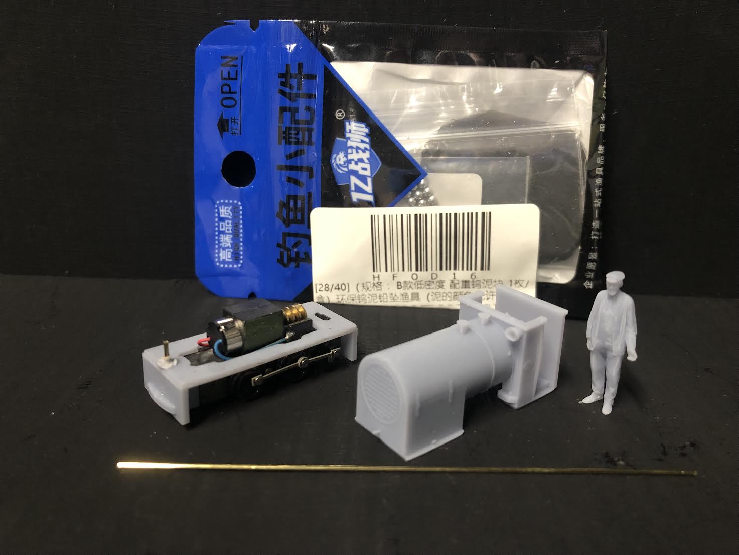 OO9 scale resin kit of a WW1 Baguley 10HP petrol locomotive with dummy chassis and 3D-scanned driver for static display