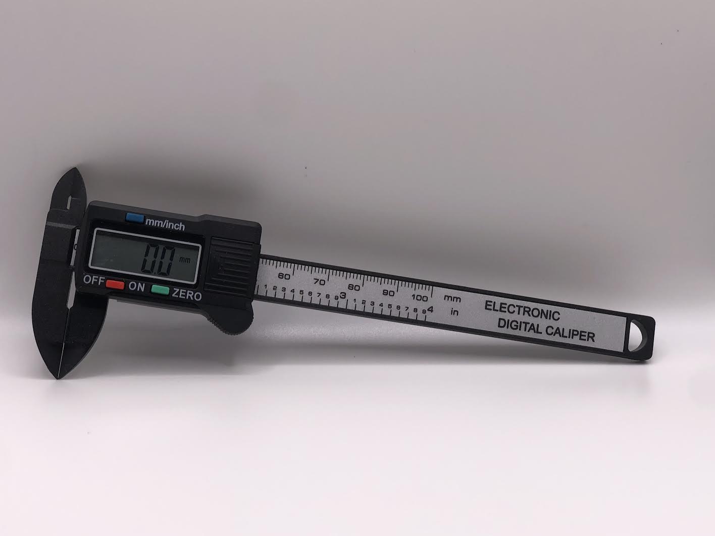 100mm carbon-fibre digital caliper measuring model railway parts and other small components with a clear LCD display