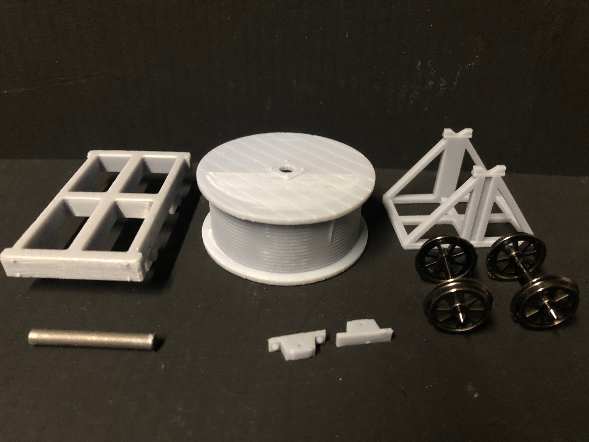 Unassembled GN15 narrow gauge cable drum wagon kit with resin body, cable supports and 12.5mm spoked wheelset for model railways