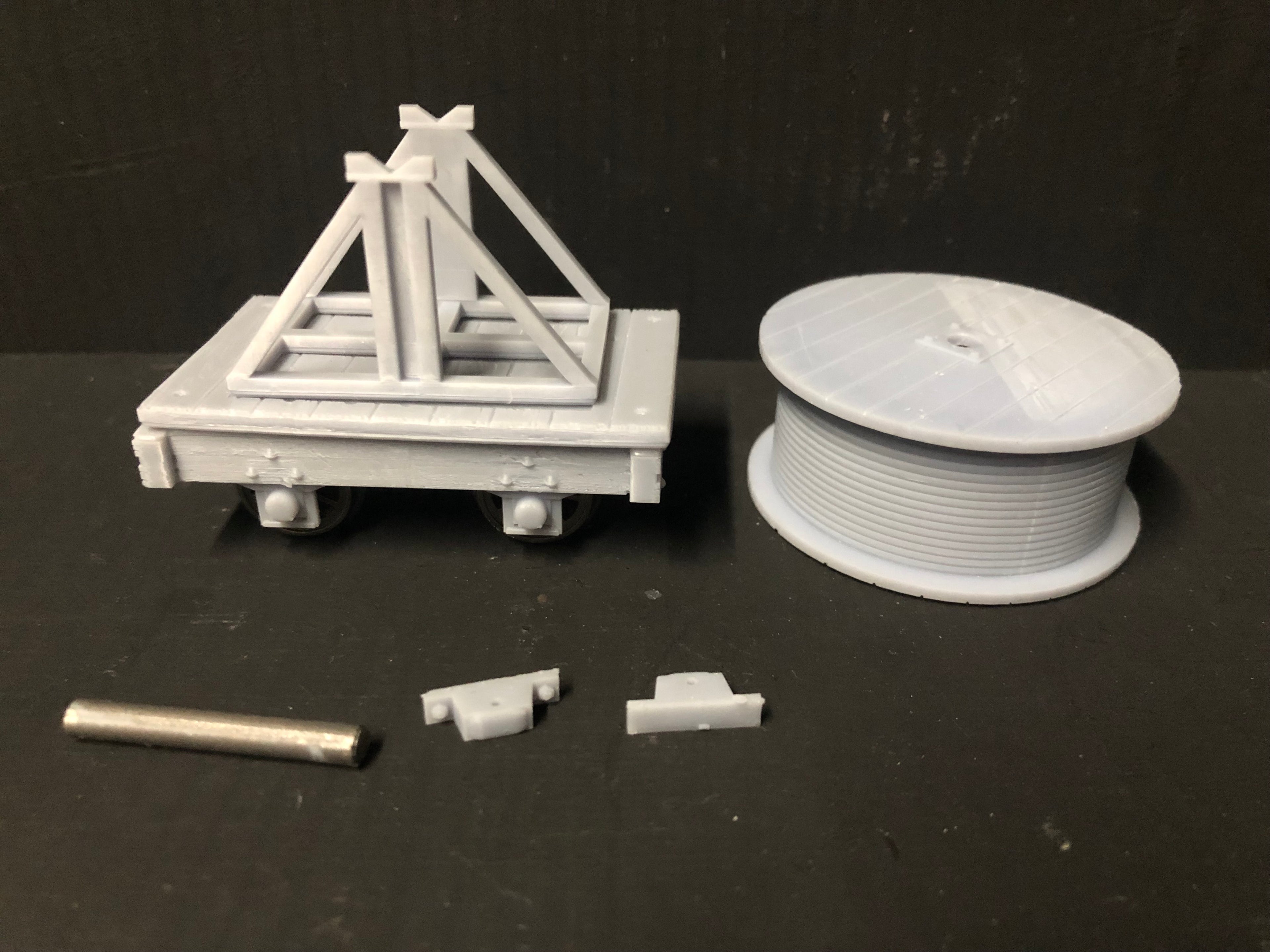 Unassembled GN15 narrow gauge cable drum wagon kit with resin body, cable supports and 12.5mm spoked wheelset for model railways