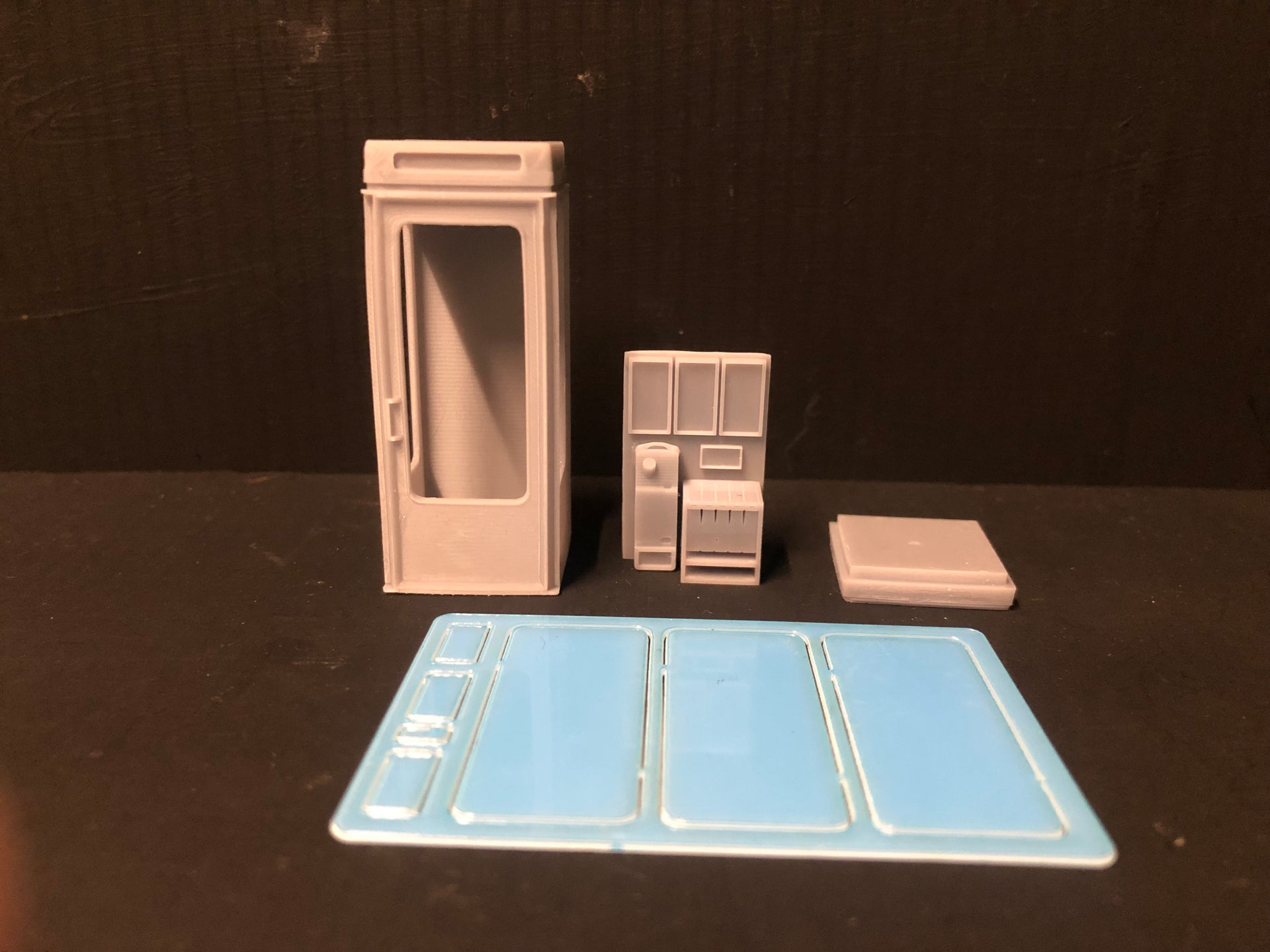 Unpainted 7mm O gauge K8 1970s British telephone box model kit with glazing and interior detail for NG7 and On18 layouts