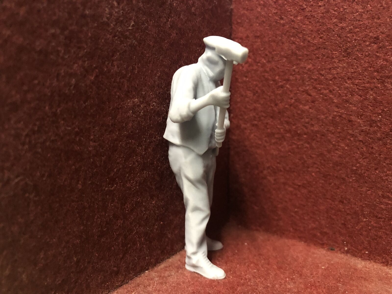 Unpainted G-scale 1:22 figure of a man holding a sledgehammer, suitable for GN15 narrow gauge model railway scenes.