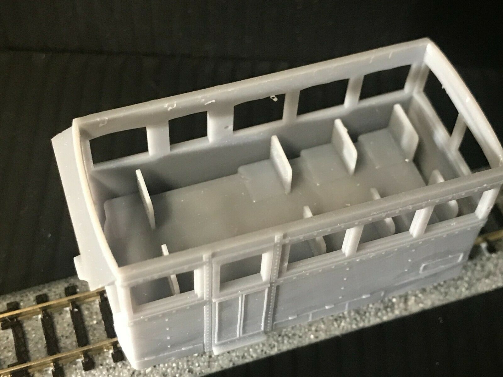 OO9 narrow gauge prototype tram railcar body kit shown on a Kato 103/109/105 chassis, with separate roof and interior seating parts