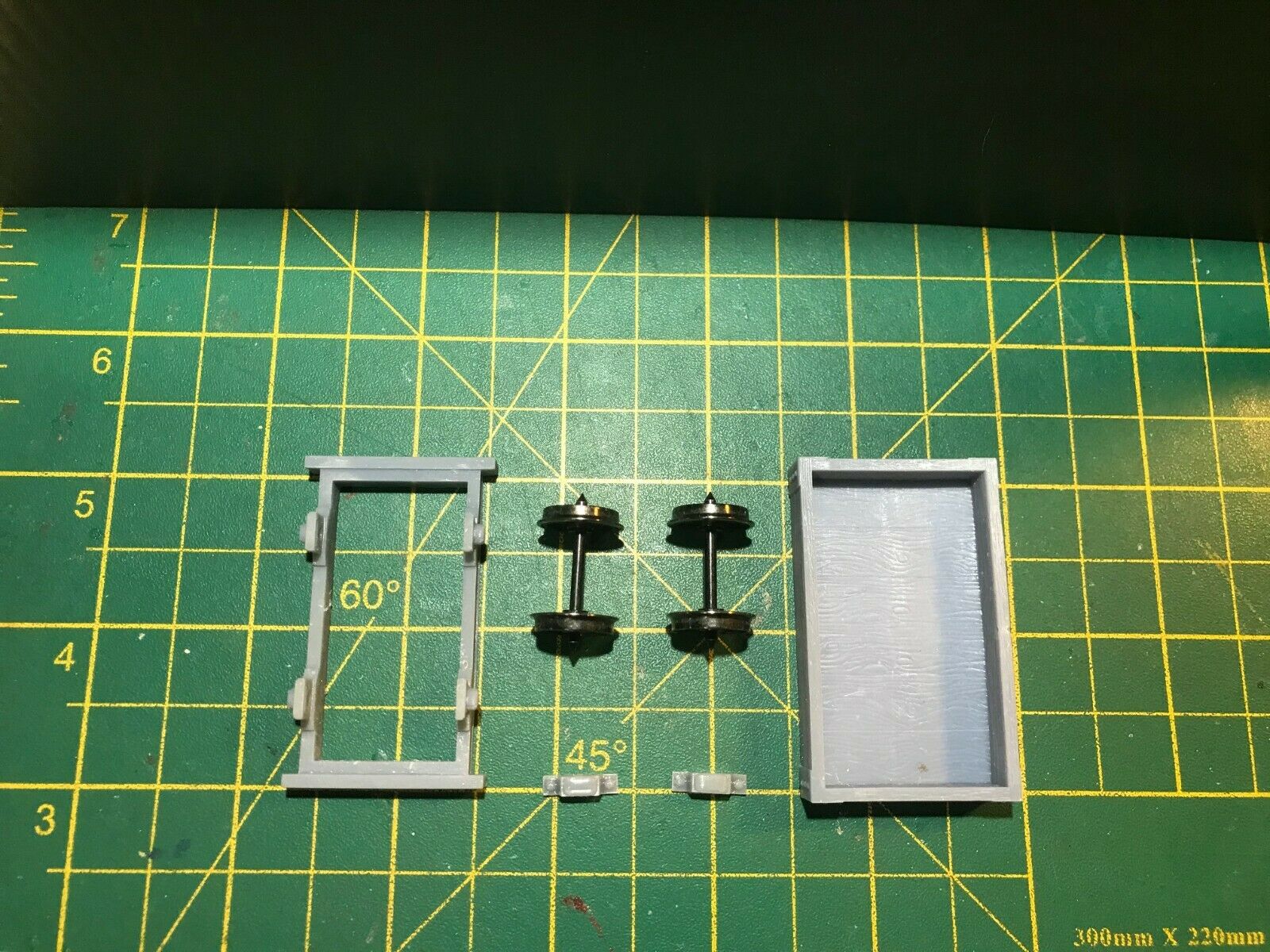 Gn15 narrow gauge single plank wagon kit shown with bogie frame and coupling blocks for 16.5mm track.