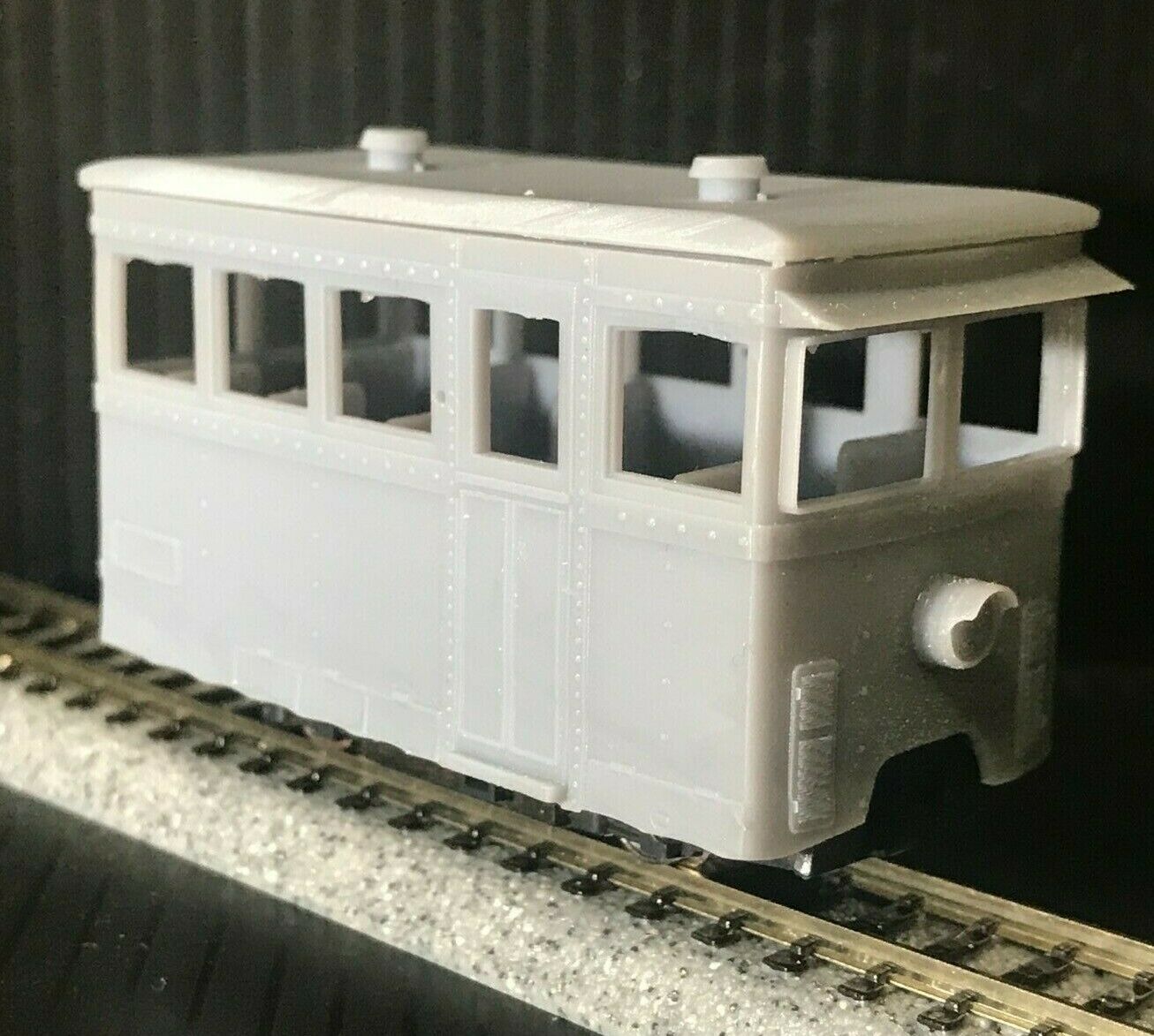 OO9 narrow gauge prototype tram railcar body kit shown on Kato 103/109/105 chassis with separate roof and interior seating