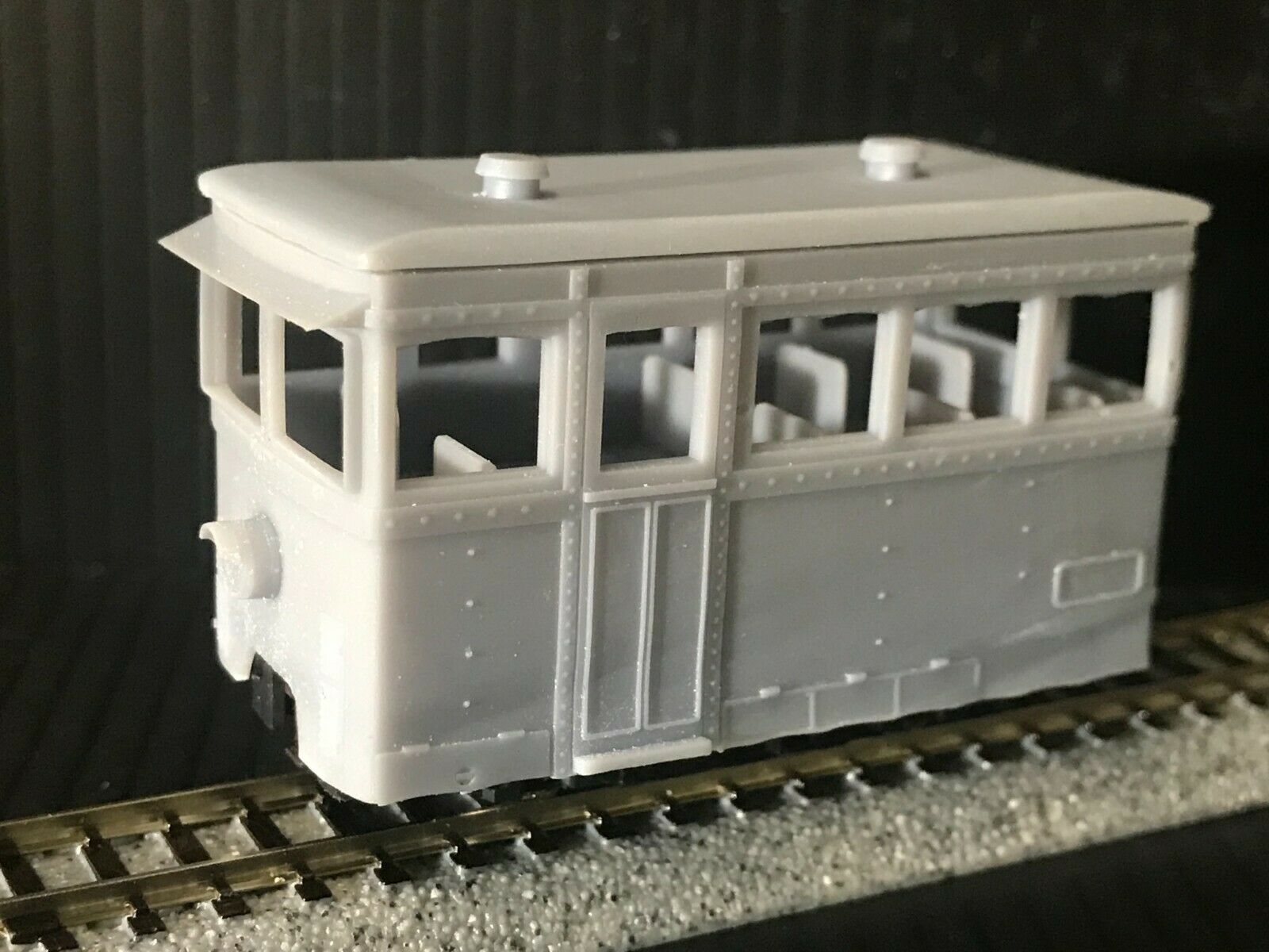 OO9 narrow gauge prototype tram railcar body kit shown on Kato 103/109/105 chassis with removable roof and interior seating