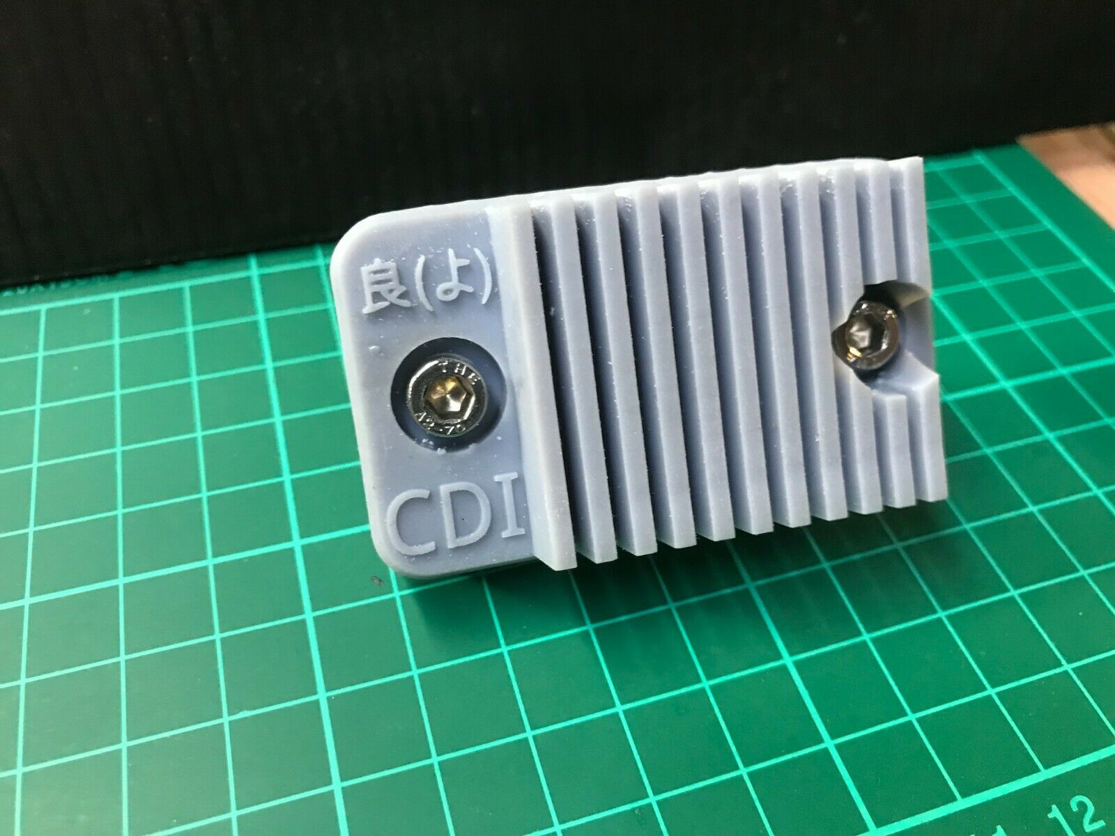 Stealth covert case for an Apple AirTag, designed to mount discreetly on a car or motorbike for hidden tracking