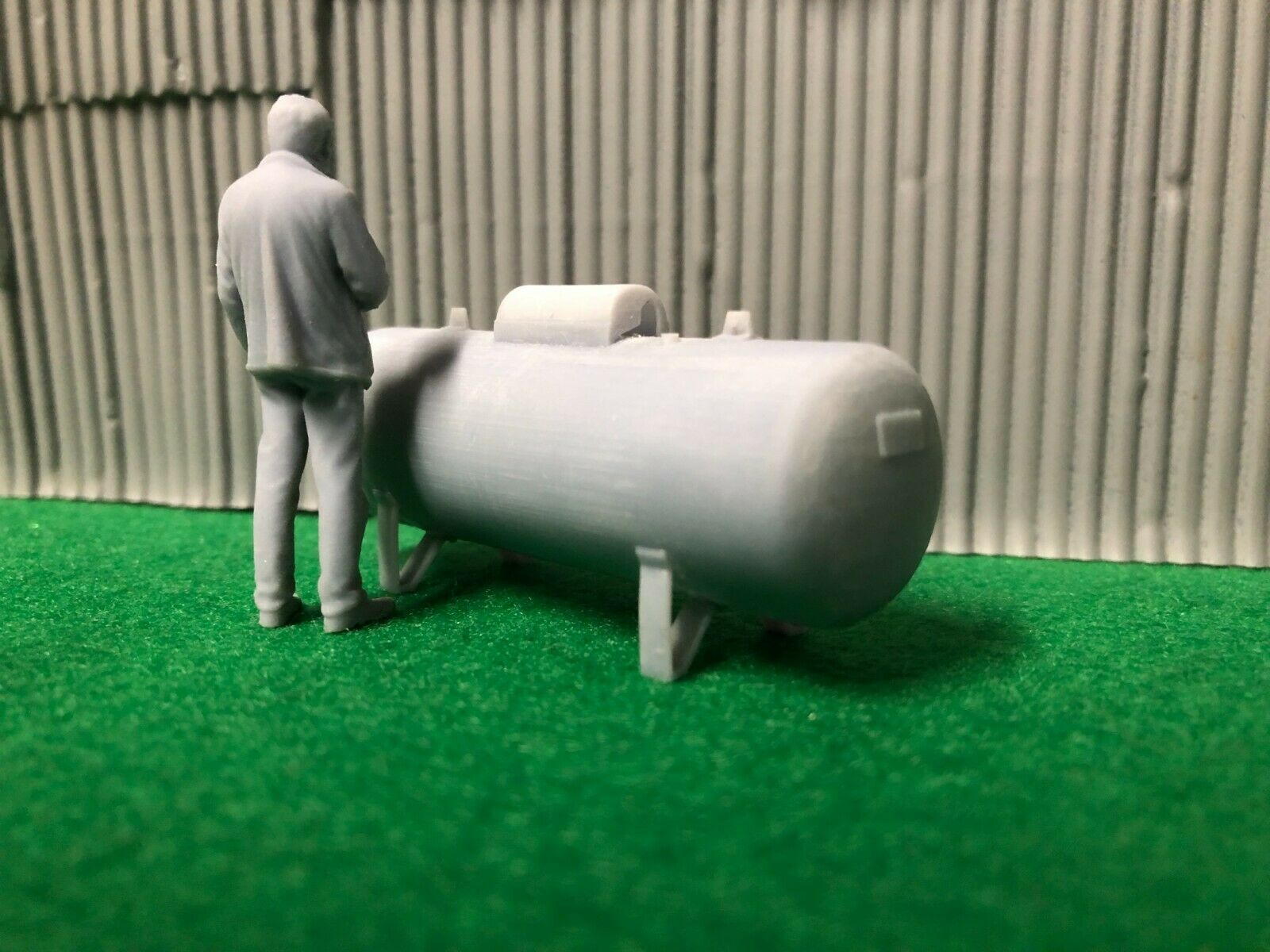 O scale unpainted resin propane tank with brass gas pipe wire and 3D-scanned figure for model railway scenery.