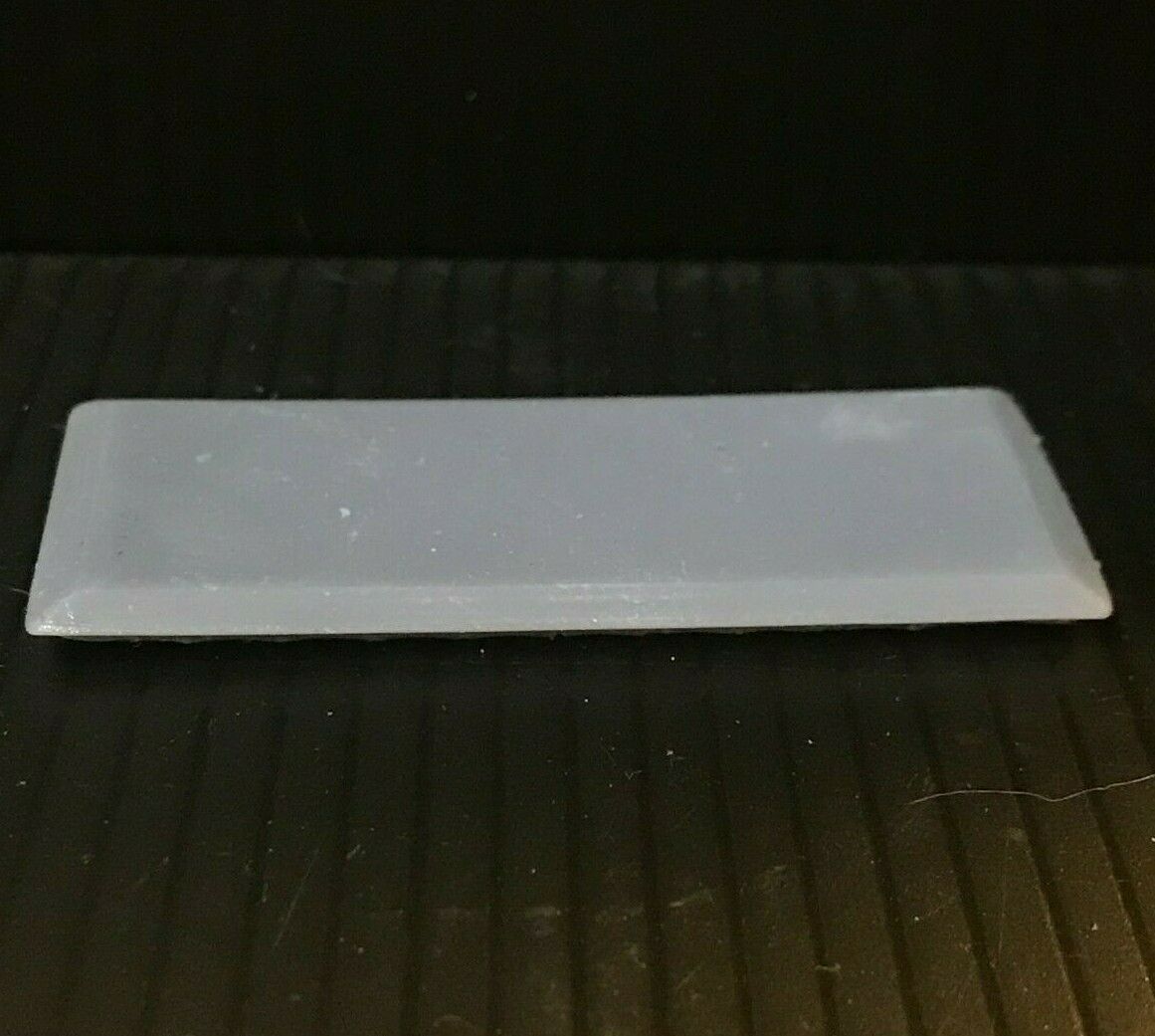 Unpainted OO9 narrow gauge prototype railbus body, roof and interior kit shown on a compatible Kato 103/109/105 chassis