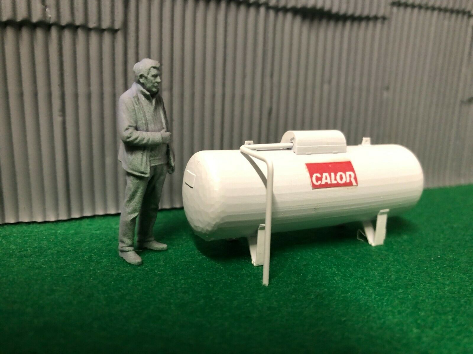 O scale unpainted resin propane tank with brass gas pipe wire and 3D-scanned O scale figure for model railway scenery.