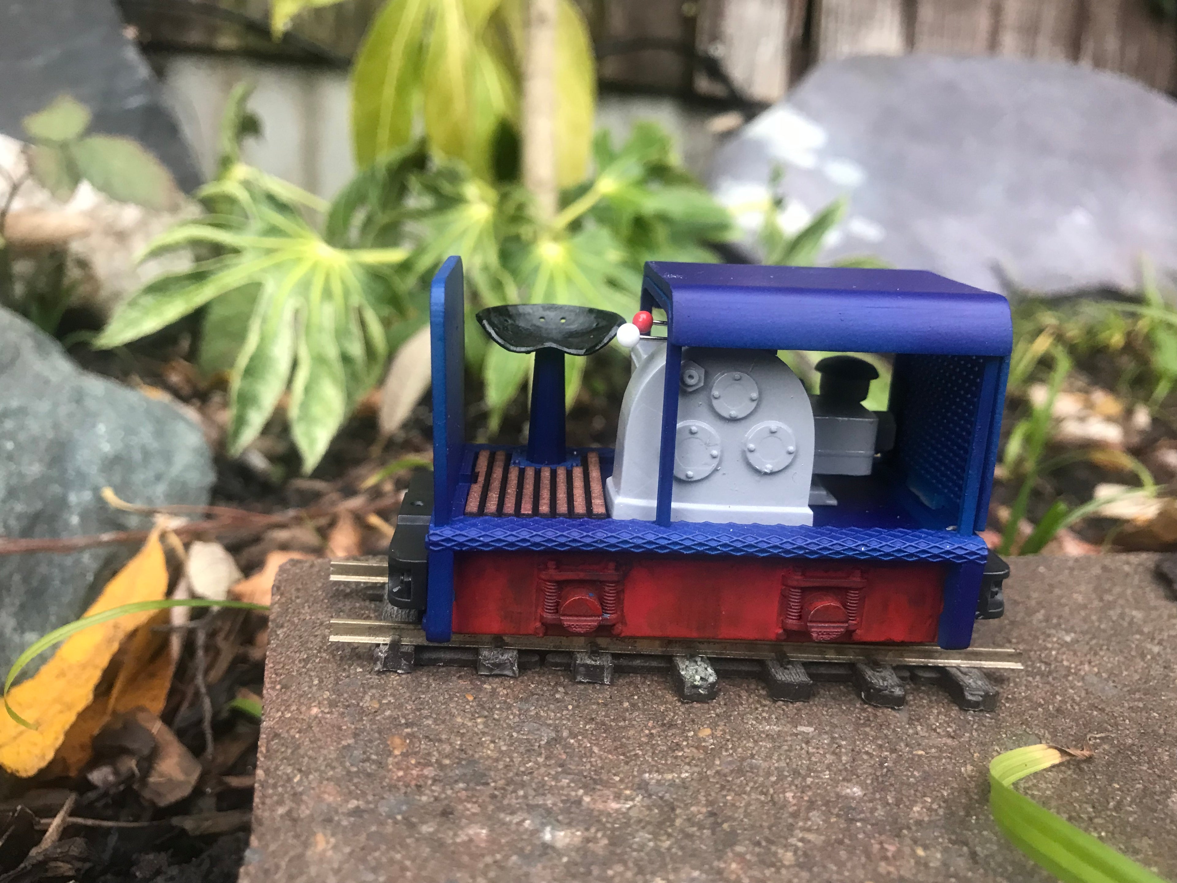 Unpainted GN15 diesel critter locomotive kit in G scale for OO gauge track, shown with a Tenshodo motor bogie chassis