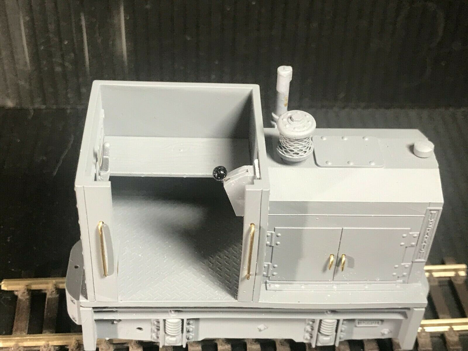 Unpainted GN15 diesel critter locomotive kit in G scale for 00 gauge track, shown on a Tenshodo spud motor bogie chassis