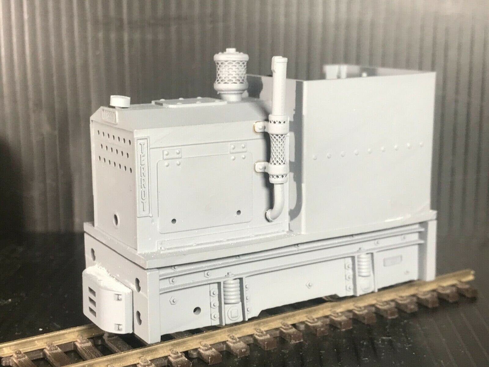 Unpainted GN15 diesel critter locomotive kit in G scale for 00 gauge track, shown on a Tenshodo spud motor bogie chassis