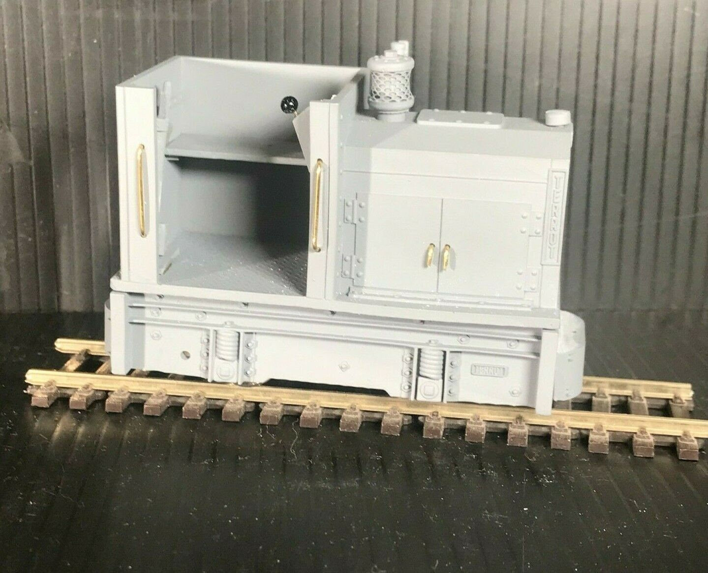 Unpainted GN15 diesel critter locomotive kit for G scale on 00 gauge track, shown on a Tenshodo spud motor bogie chassis