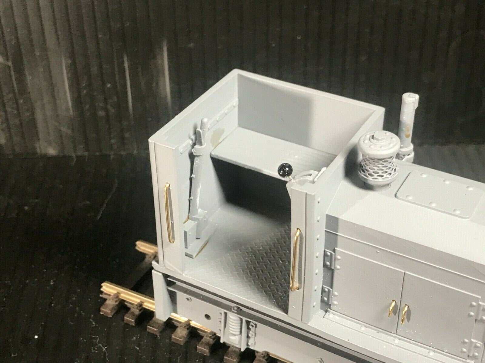 Unpainted GN15 diesel critter locomotive kit in G scale for 00 gauge track, shown on a Tenshodo spud motor bogie chassis